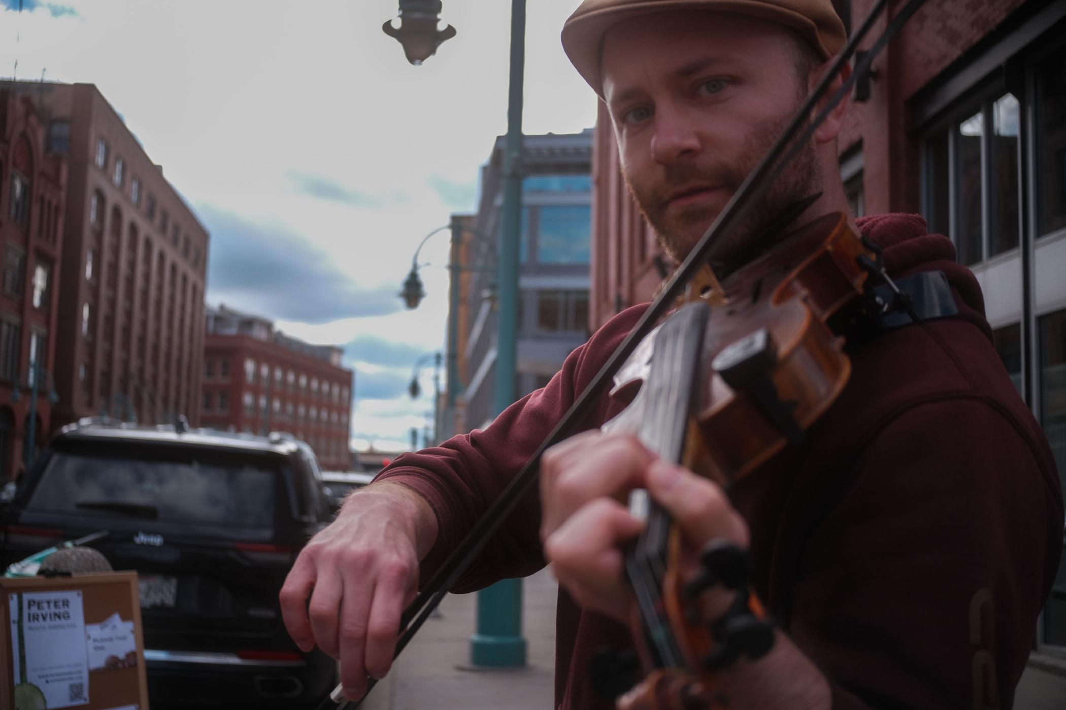 Peter Irving playing banjo by the lake